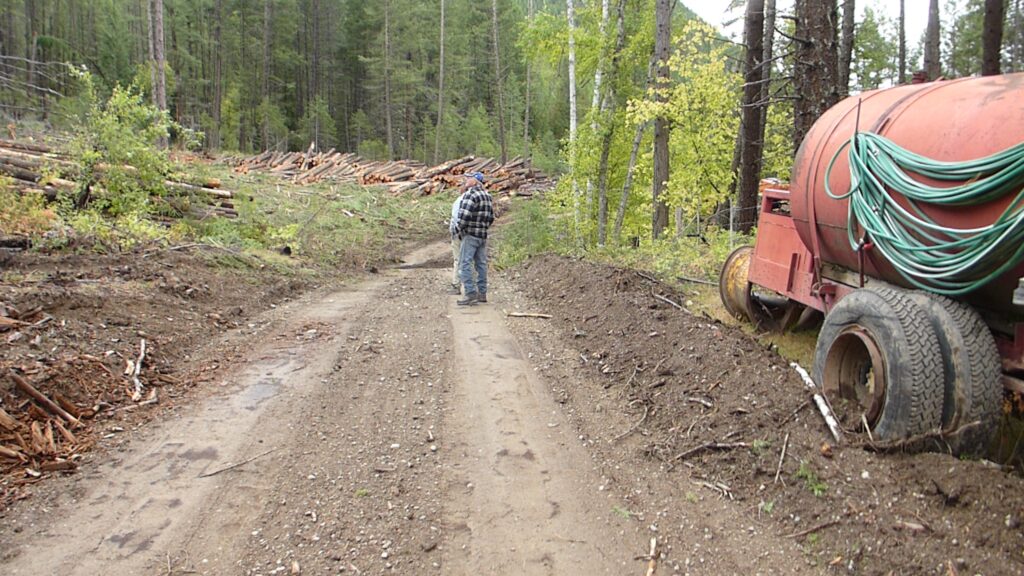 Retired loggers with BFWSS in a cutblock in the Kettle River watershed inspecting logging problems